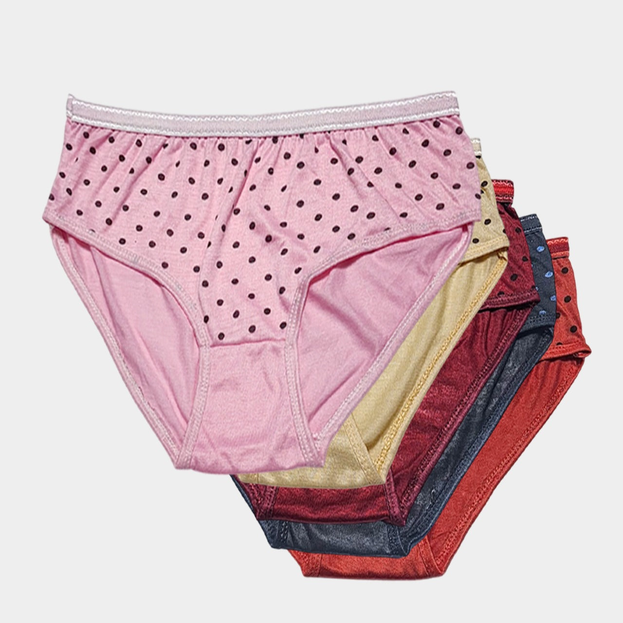 Stack of women's underwear in various colors on a light gray background